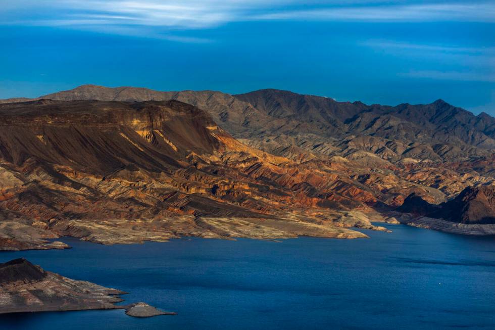 The Fortification Hill area catches the late-day light above the receding Lake Mead shoreline o ...