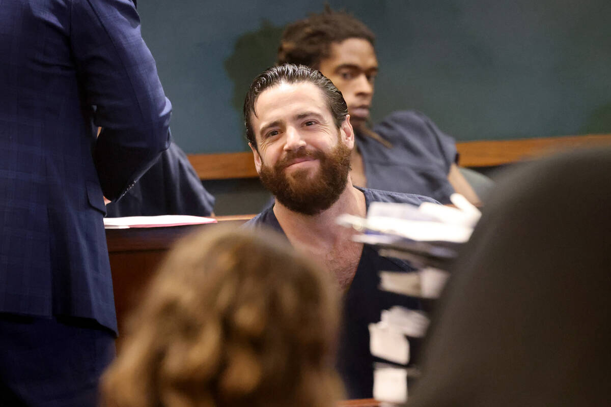 Matthew Mannix, who is accused of holding a woman hostage in a Caesars Palace hotel room, smile ...