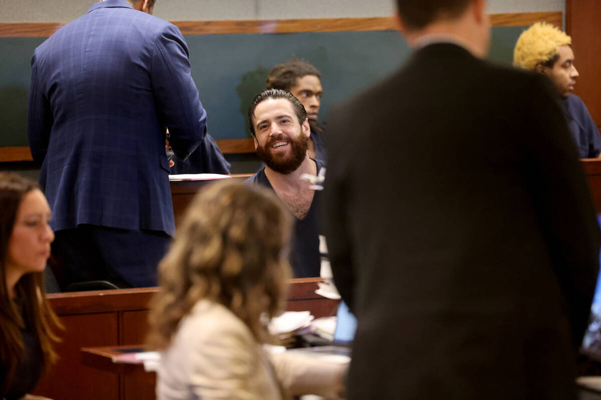 Matthew Mannix, who is accused of holding a woman hostage in a Caesars Palace hotel room, smile ...