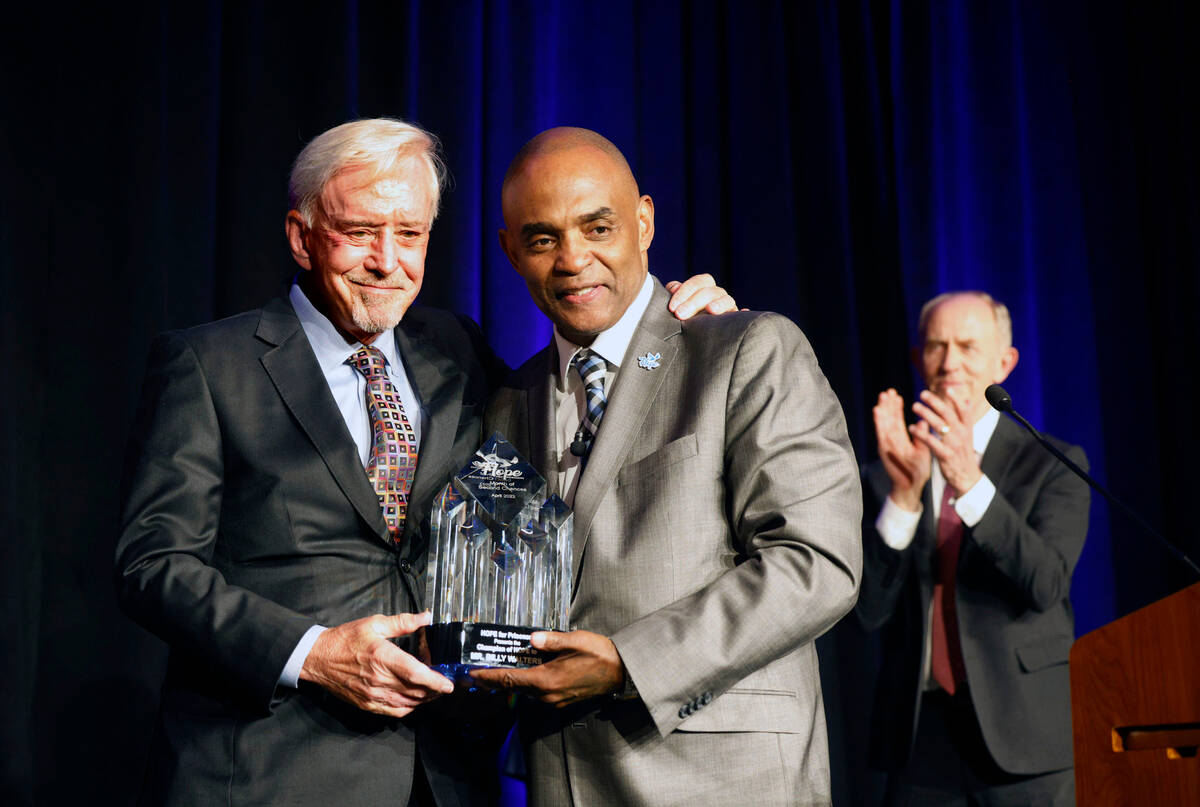 Billy Walters, left, poses for a photo with Jon Ponder, founder and CEO of Hope for Prisoners, ...