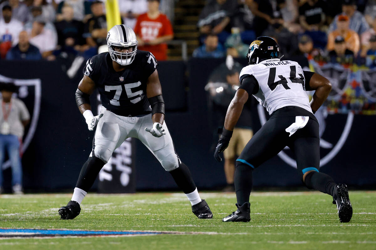 Las Vegas Raiders offensive tackle Brandon Parker (75) looks to block Jacksonville Jaguars line ...