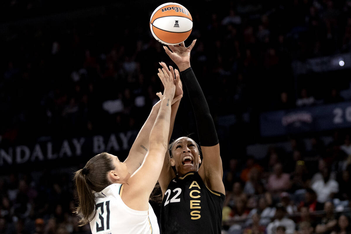 Las Vegas Aces forward A'ja Wilson (22) shoots against New York Liberty center Stefanie Dolson ...