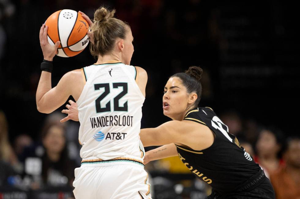 Las Vegas Aces guard Kelsey Plum (10) defends against New York Liberty guard Courtney Vanderslo ...