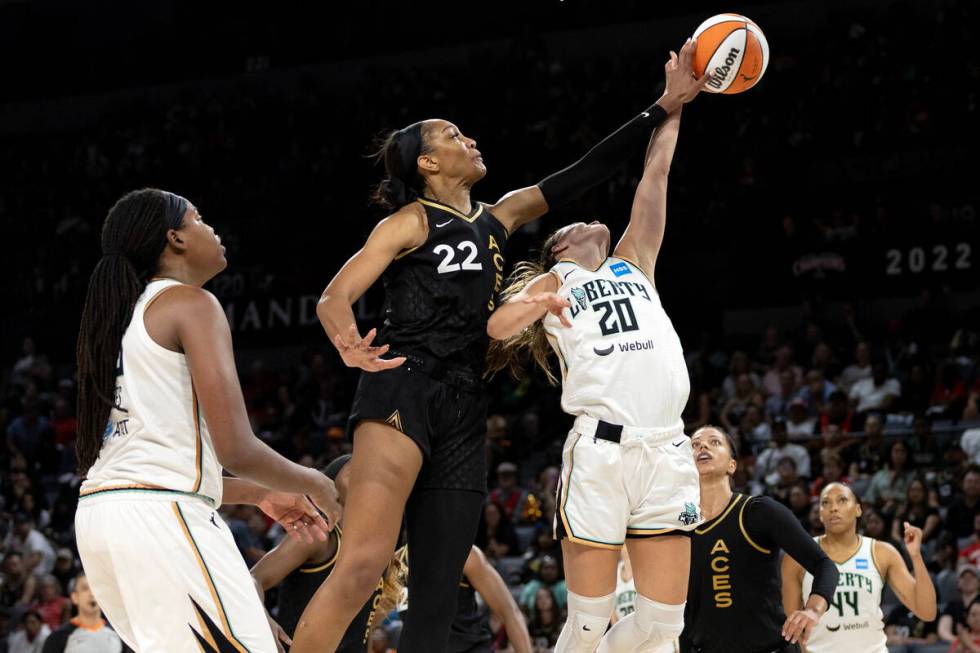 Las Vegas Aces forward A'ja Wilson (22) blocks a shot by New York Liberty guard Sabrina Ionescu ...