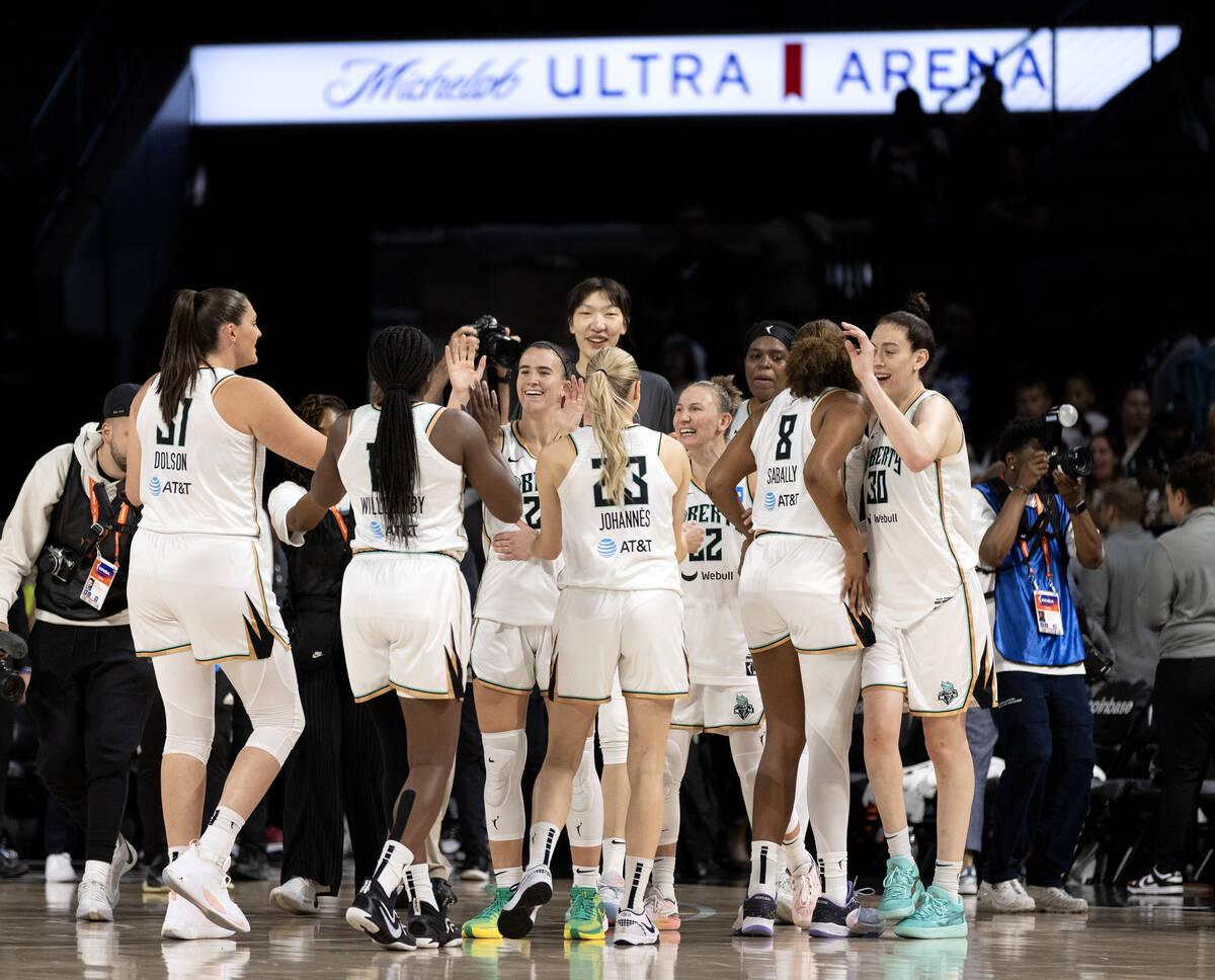 The New York Liberty celebrate after winning the WNBA basketball Commissioner’s Cup cham ...