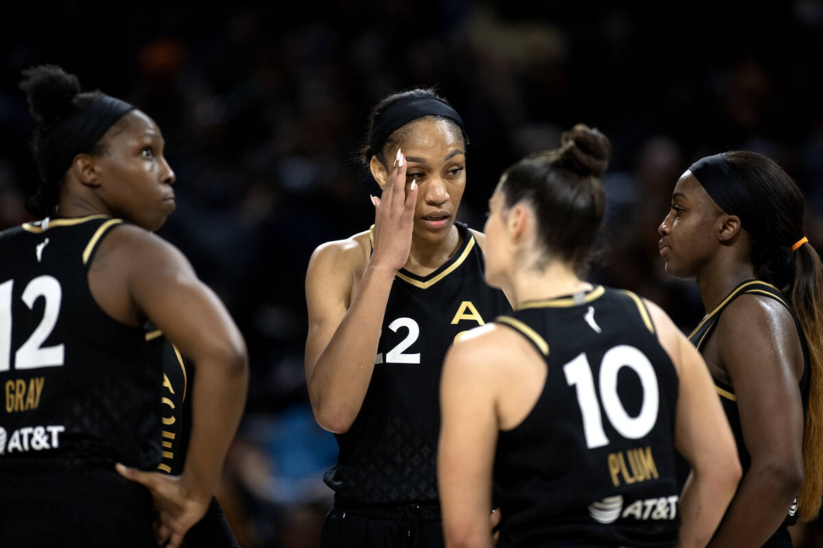 The Las Vegas Aces gather in between play during the second half of a WNBA basketball Commissio ...