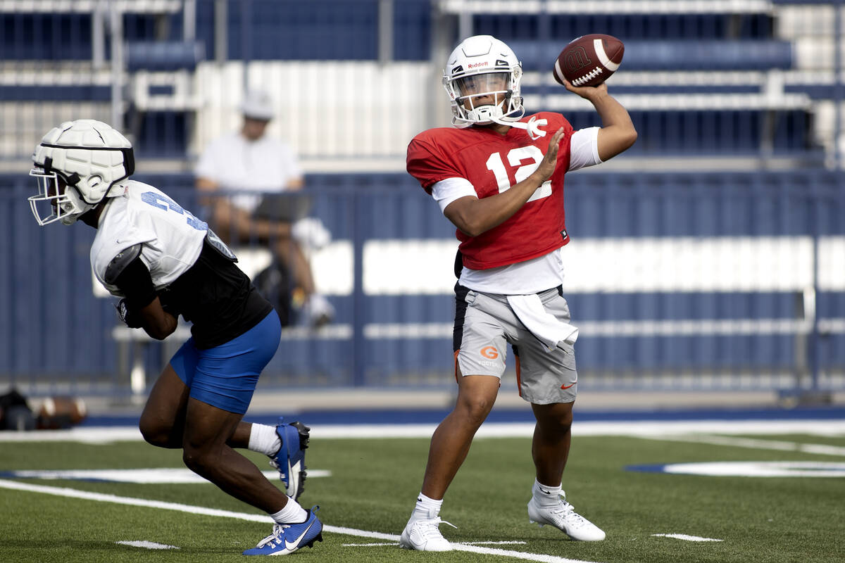 Bishop Gorman's starting quarterback Micah Alejado (12) looks to pass during football practice ...