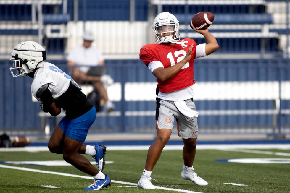 Bishop Gorman's starting quarterback Micah Alejado (12) looks to pass during football practice ...