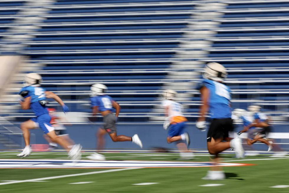 Bishop Gorman players run the field during football practice at Bishop Gorman High School on We ...