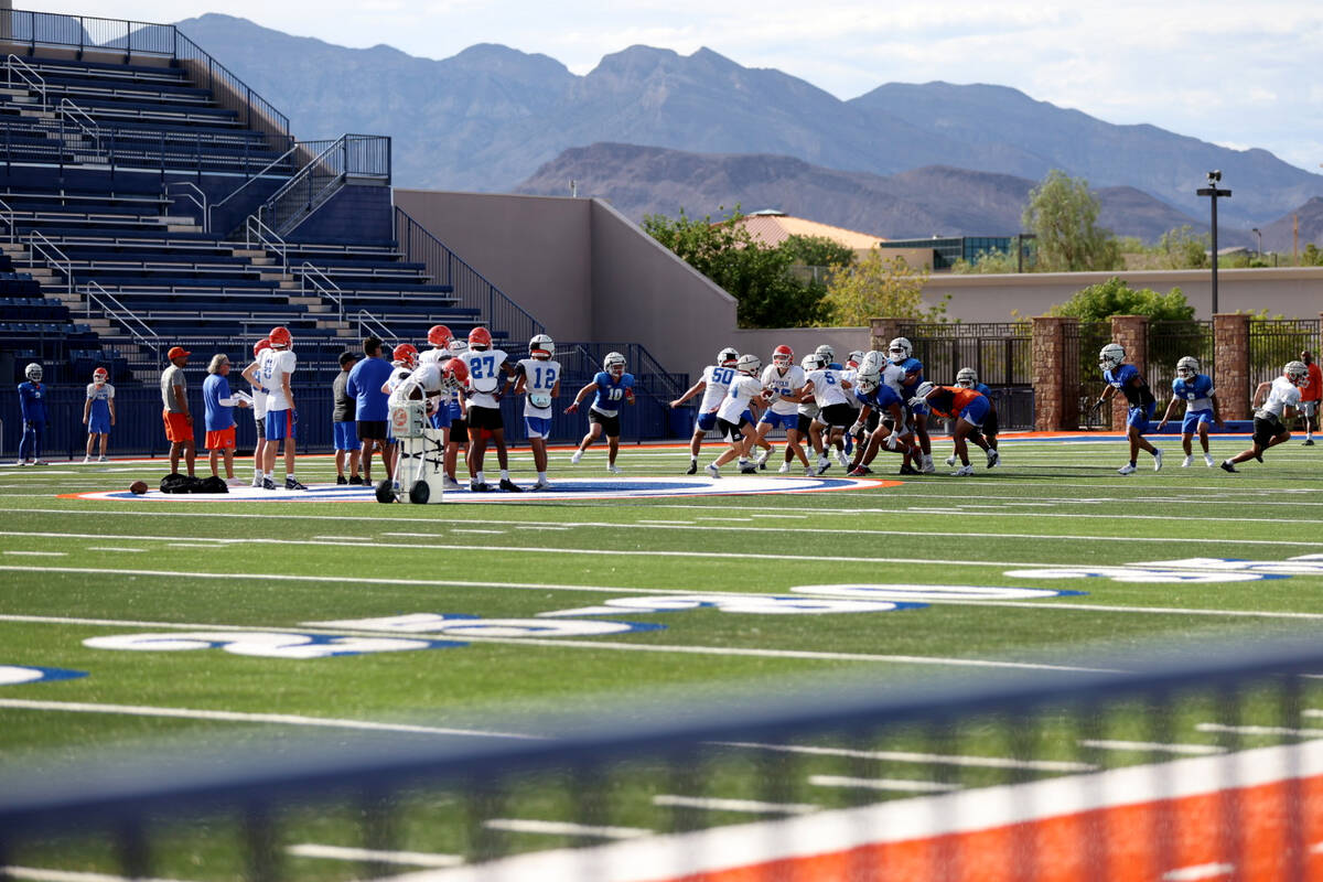 Bishop Gorman players run drills during football practice at Bishop Gorman High School on Wedne ...