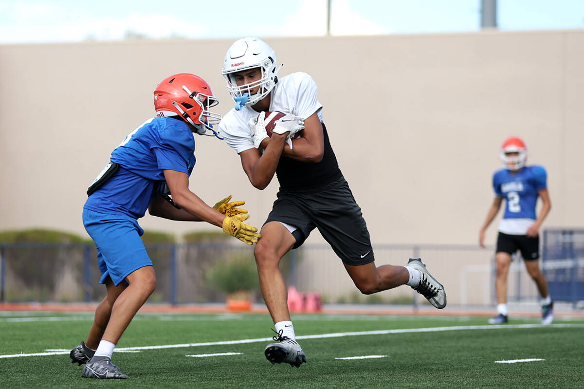 Bishop Gorman players run drills during football practice at Bishop Gorman High School on Wedne ...