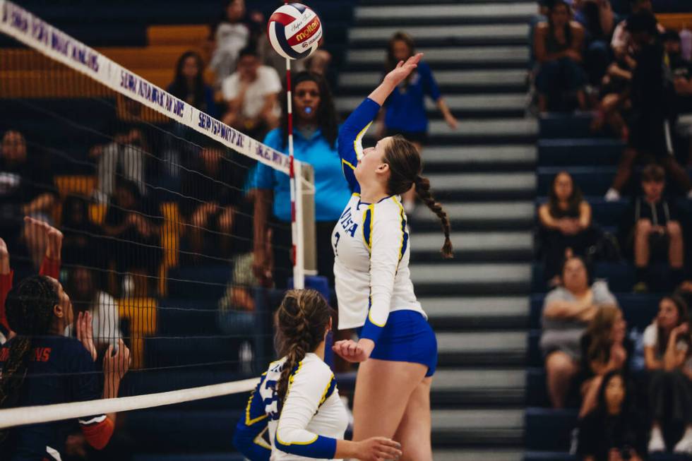 Sierra Vista middle blocker Nicole Mcmanus (3) sends the ball back over the net during a match ...