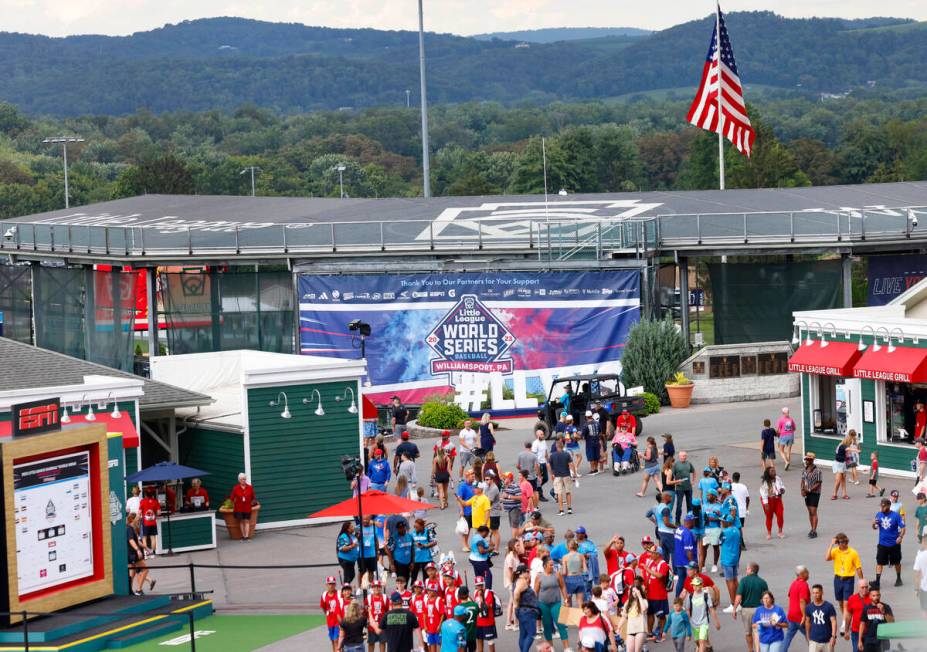 Fans and players arrive at Howard J. Lamade Stadium where the Little League World Series tourna ...