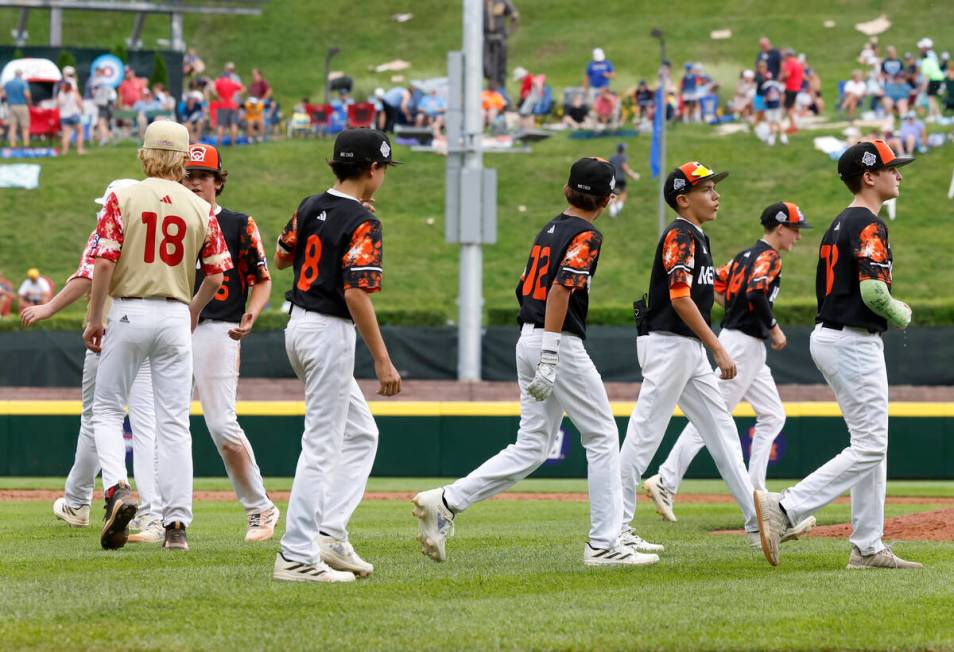 The Henderson All-Stars starting pitcher Nolan Gifford (18) shakes hands with Rhode Island pitc ...