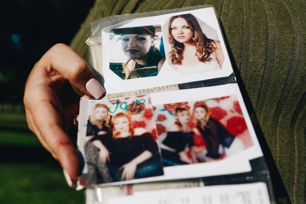 Danielle Wingett holds old photographs of her friend, Jodi Brewer, who was found dead after goi ...