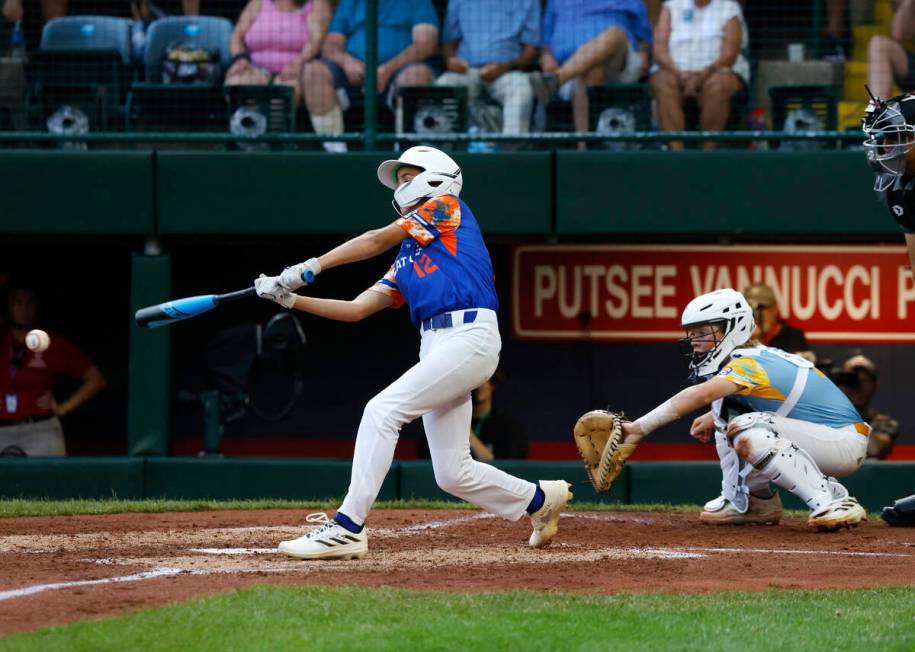 New Albany All-Stars Austin Sturmi connects against El Segundo California All-Stars during the ...