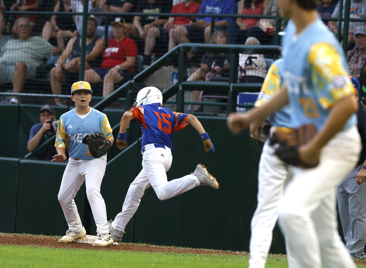 New Albany All-Stars Lincoln Luffler beats a throw and lands safe at first as El Segundo Califo ...