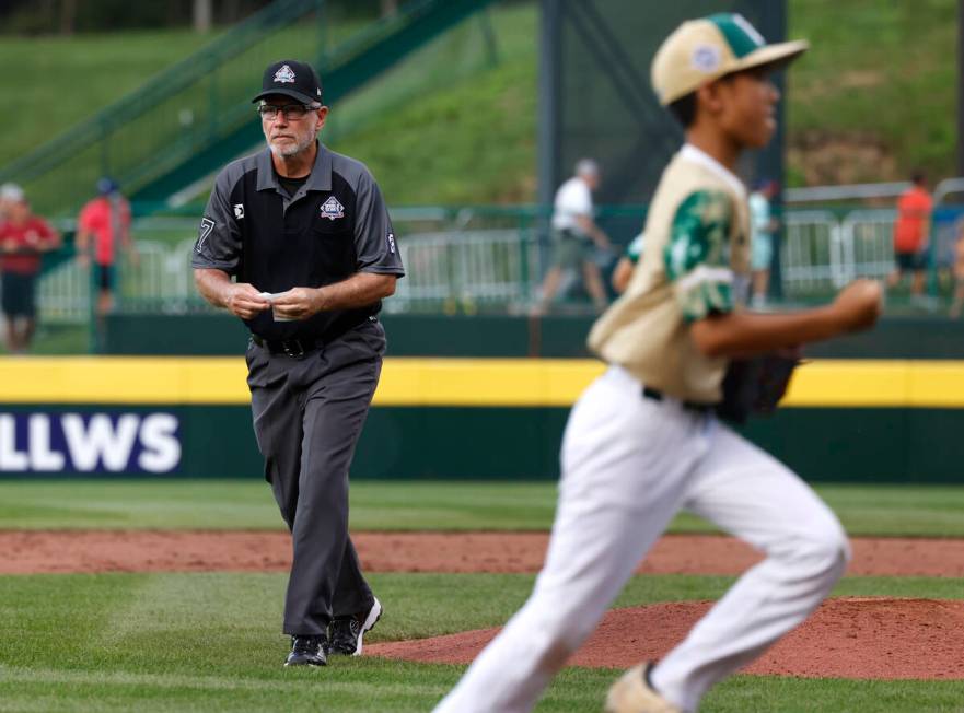 Second base umpire Ben Sprague of Las Vegas leaves the field after the Little League World Seri ...