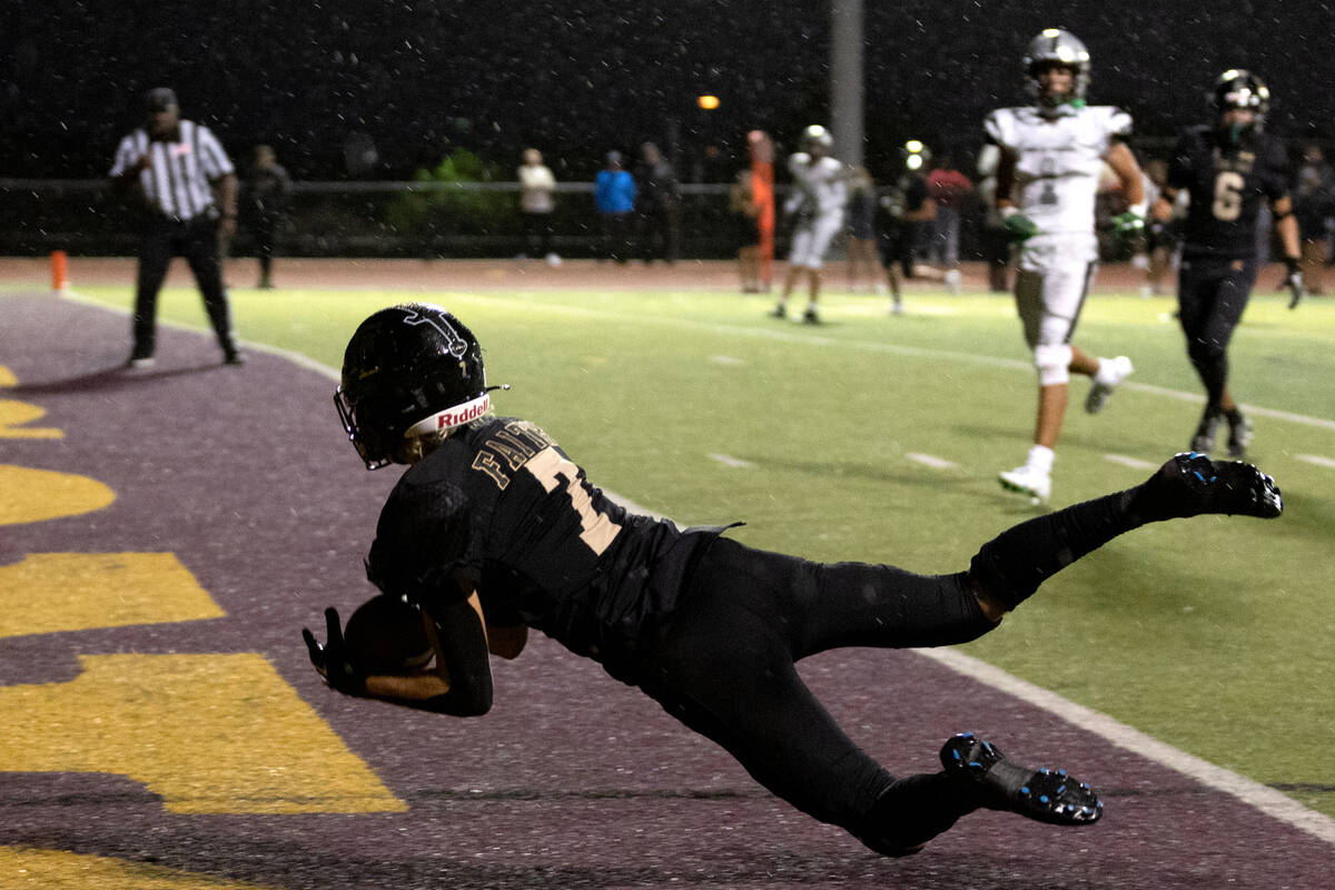 Faith Lutheran wide receiver Mason Aday (7) dives to catch for a touchdown during the second ha ...