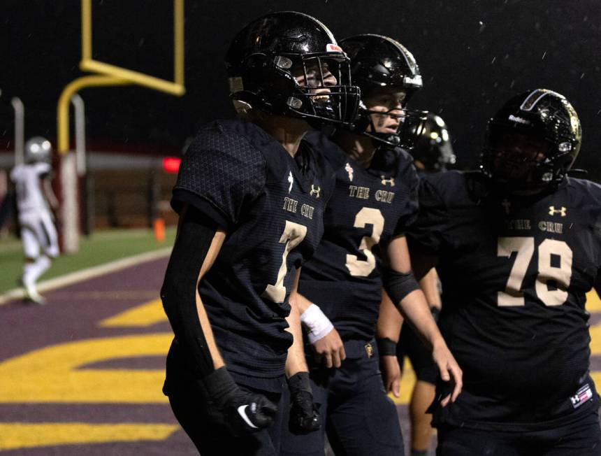 Faith Lutheran wide receiver Mason Aday (7) celebrates with teammates Garyt Odom (3) and Abraha ...