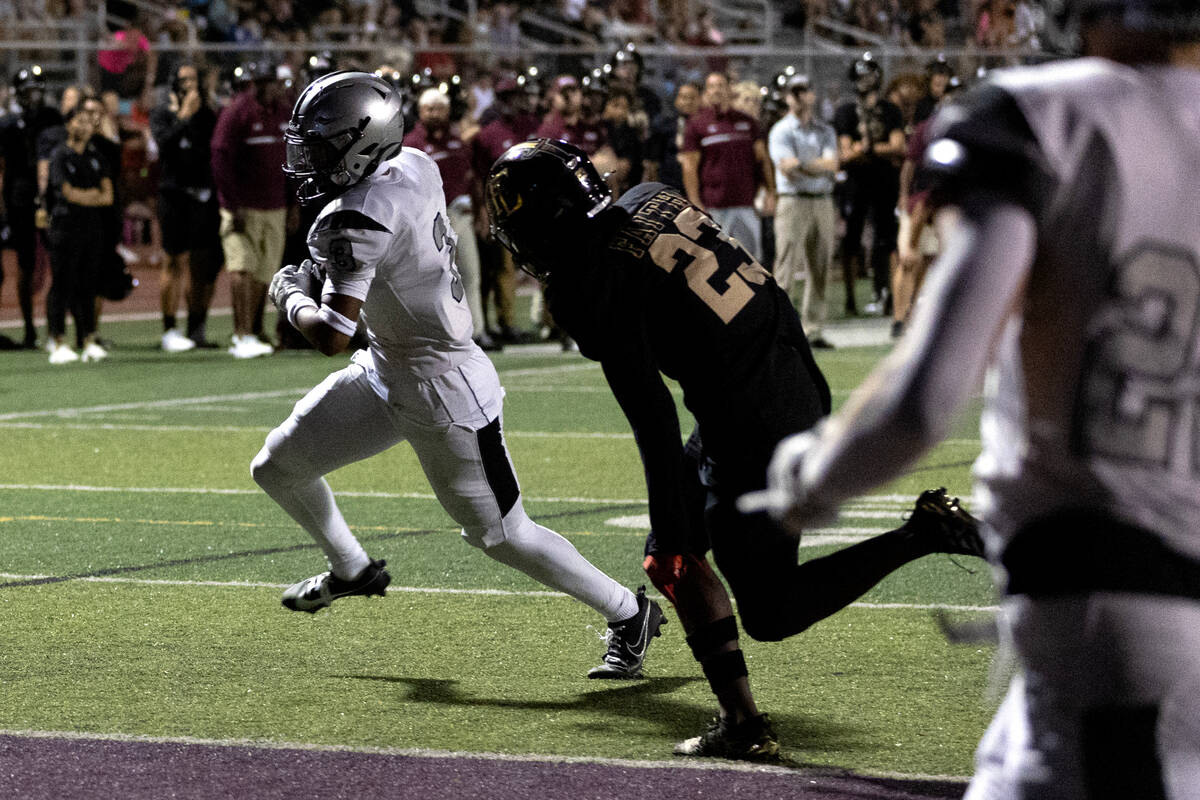 Palo Verde’s Jevon Padilla (3) is about to score a touchdown while Faith Lutheran&#x2019 ...