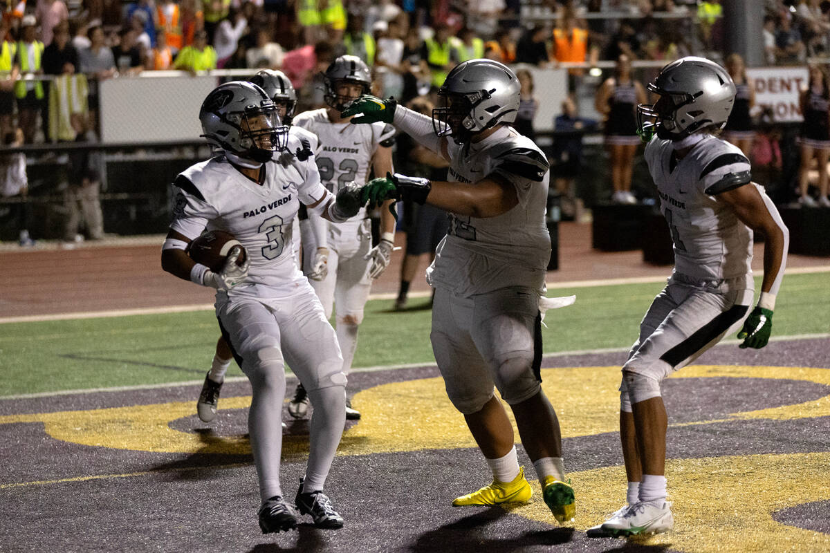 Palo Verde’s Jevon Padilla (3) is congratulated by teammates after scoring a touchdown d ...