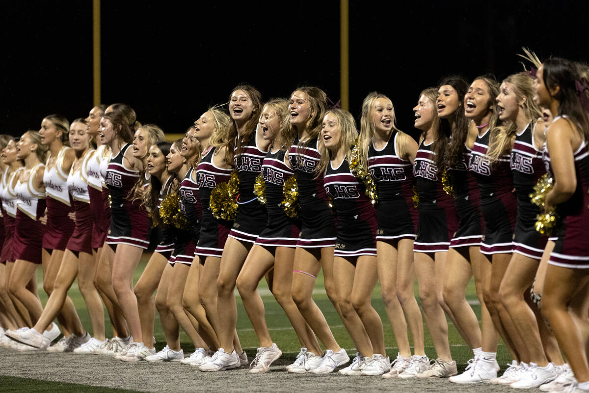 Faith Lutheran’s cheer and dance teams sing their school’s fight song after winni ...