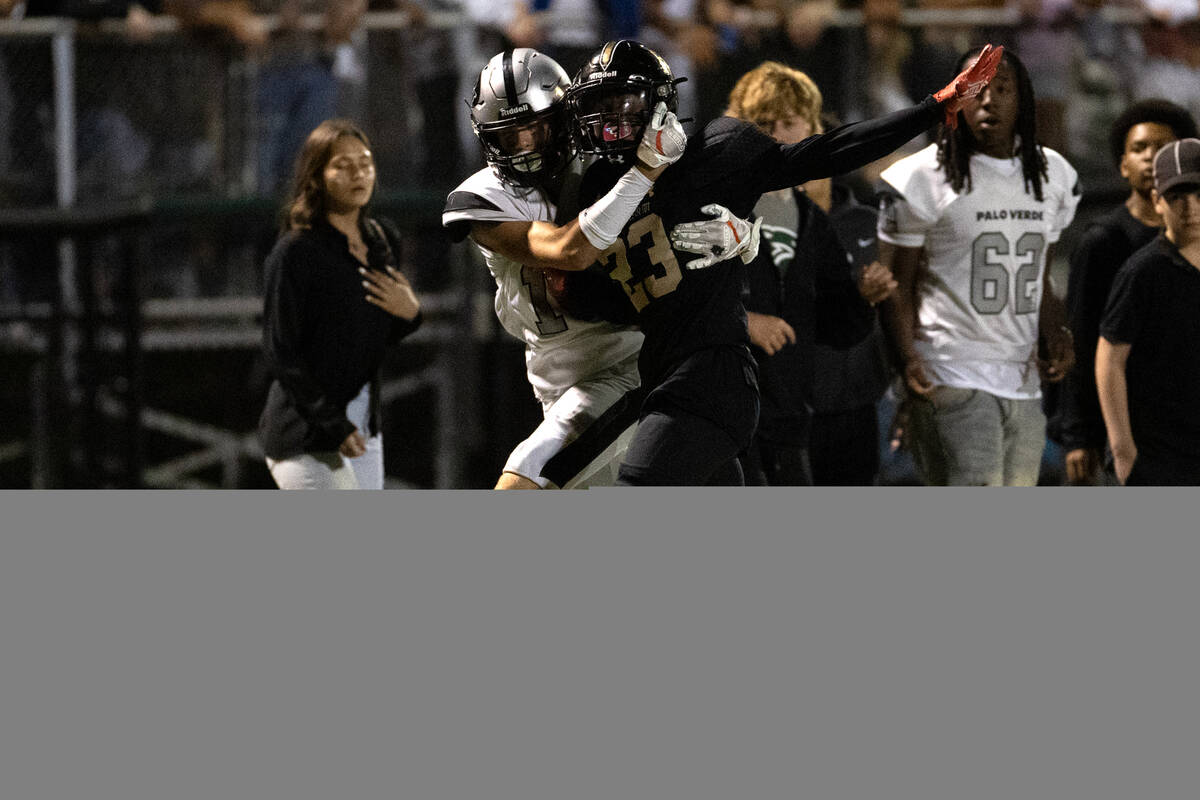 Palo Verde’s Slade Knoch pulls Faith Lutheran’s Wandley Wilson out of bounds whil ...