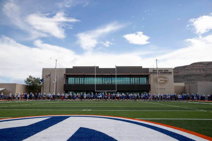 Bishop Gorman players warm up during football practice at Bishop Gorman High School on Wednesda ...