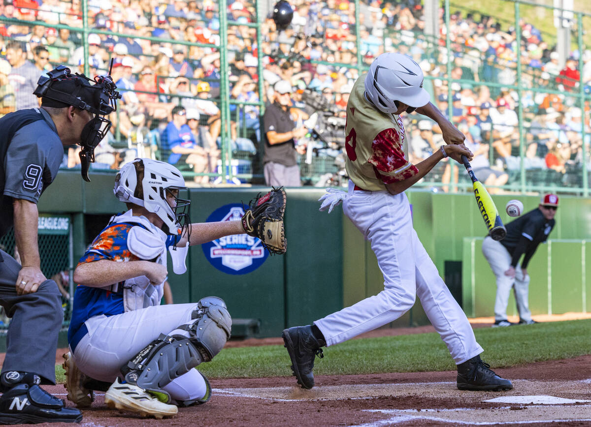 The Henderson All-Stars centerfielder JoJo Dixon connects for an RBI against New Albany, Ohio, ...
