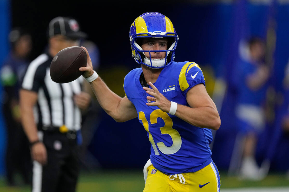 Los Angeles Rams quarterback Stetson Bennett throws during the first half of a preseason NFL fo ...