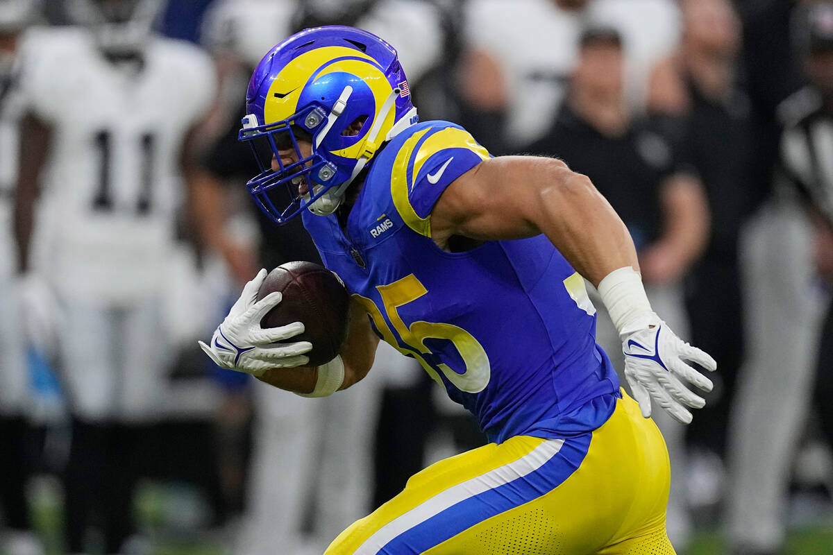 Los Angeles Rams linebacker Jacob Hummel runs an interception back for a touchdown during the f ...