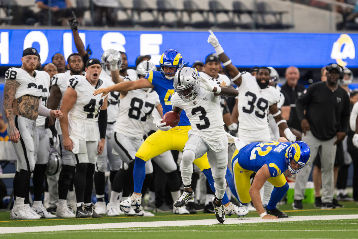 Las Vegas Raiders wide receiver DeAndre Carter (3) runs with the ball past Los Angeles Rams lon ...