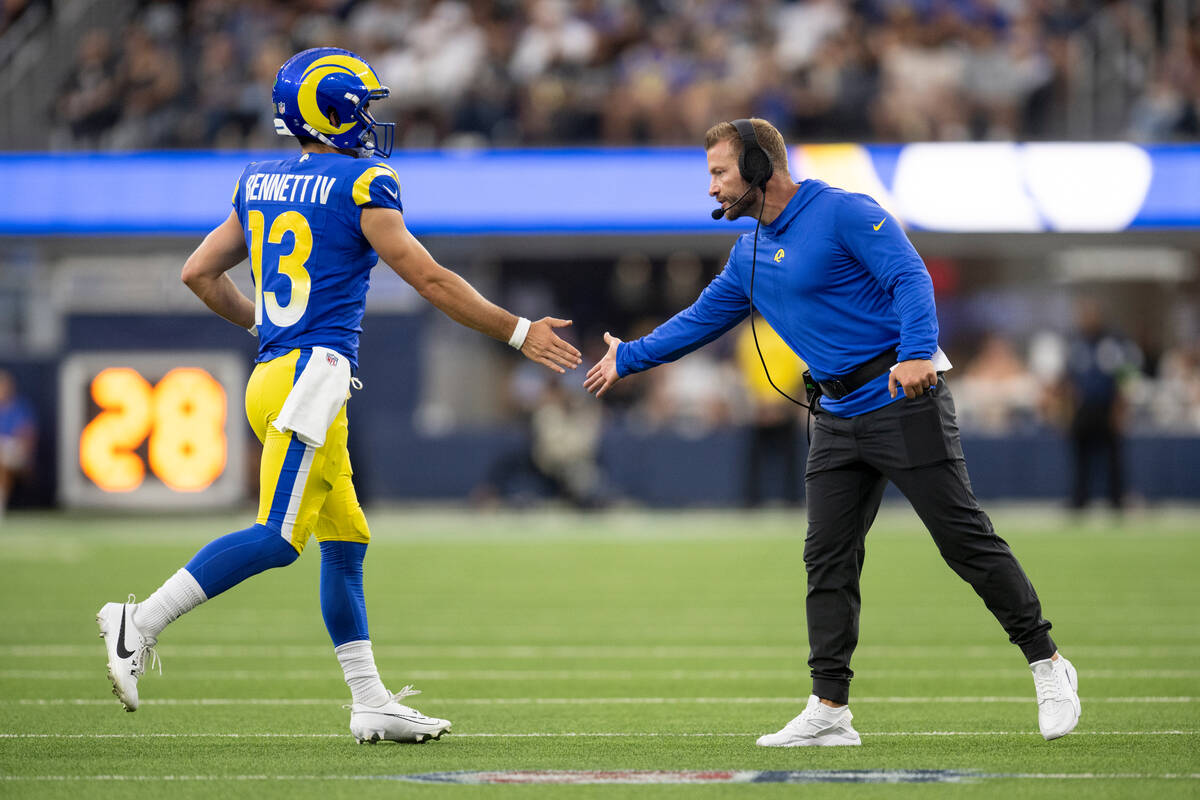 Los Angeles Rams head coach Sean McVay greets quarterback Stetson Bennett (13) during an NFL pr ...