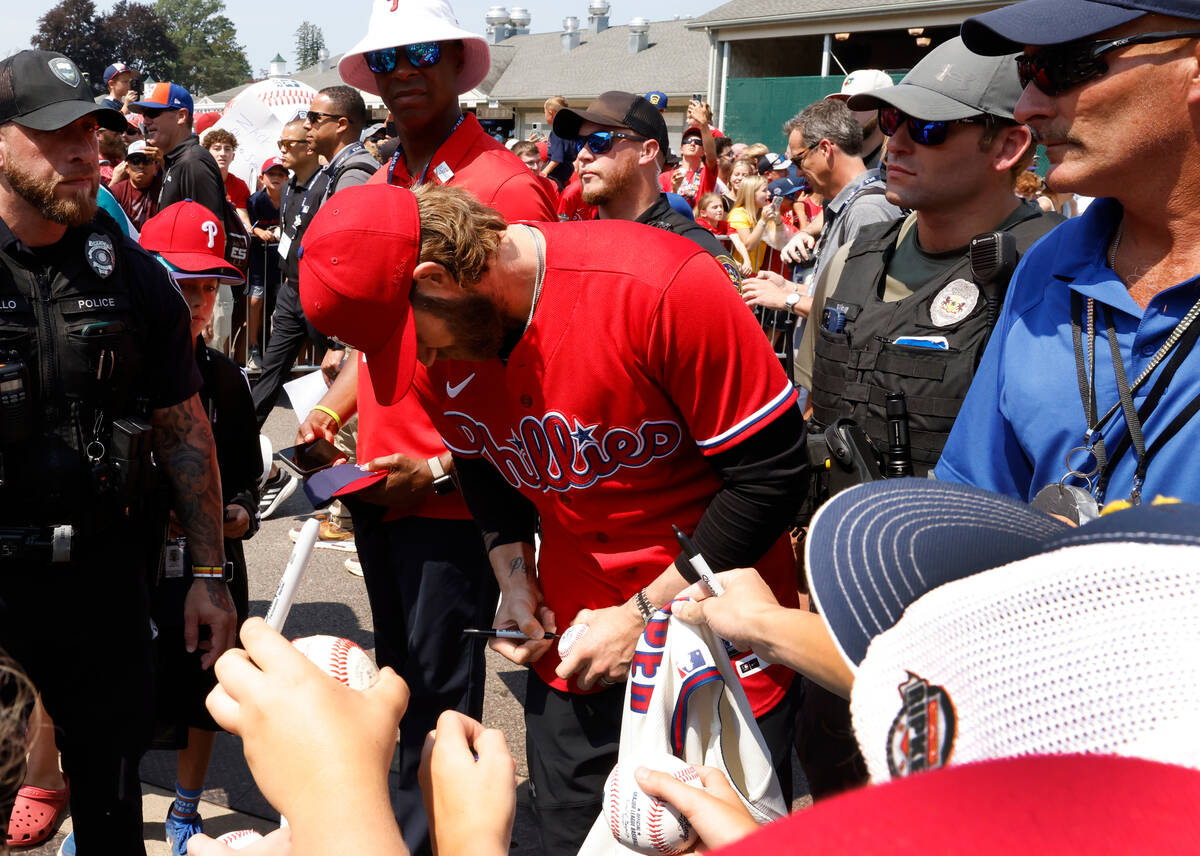 Las Vegas natives Bryce Harper of the Phillies signs autographs for fans outside of Howard J. L ...