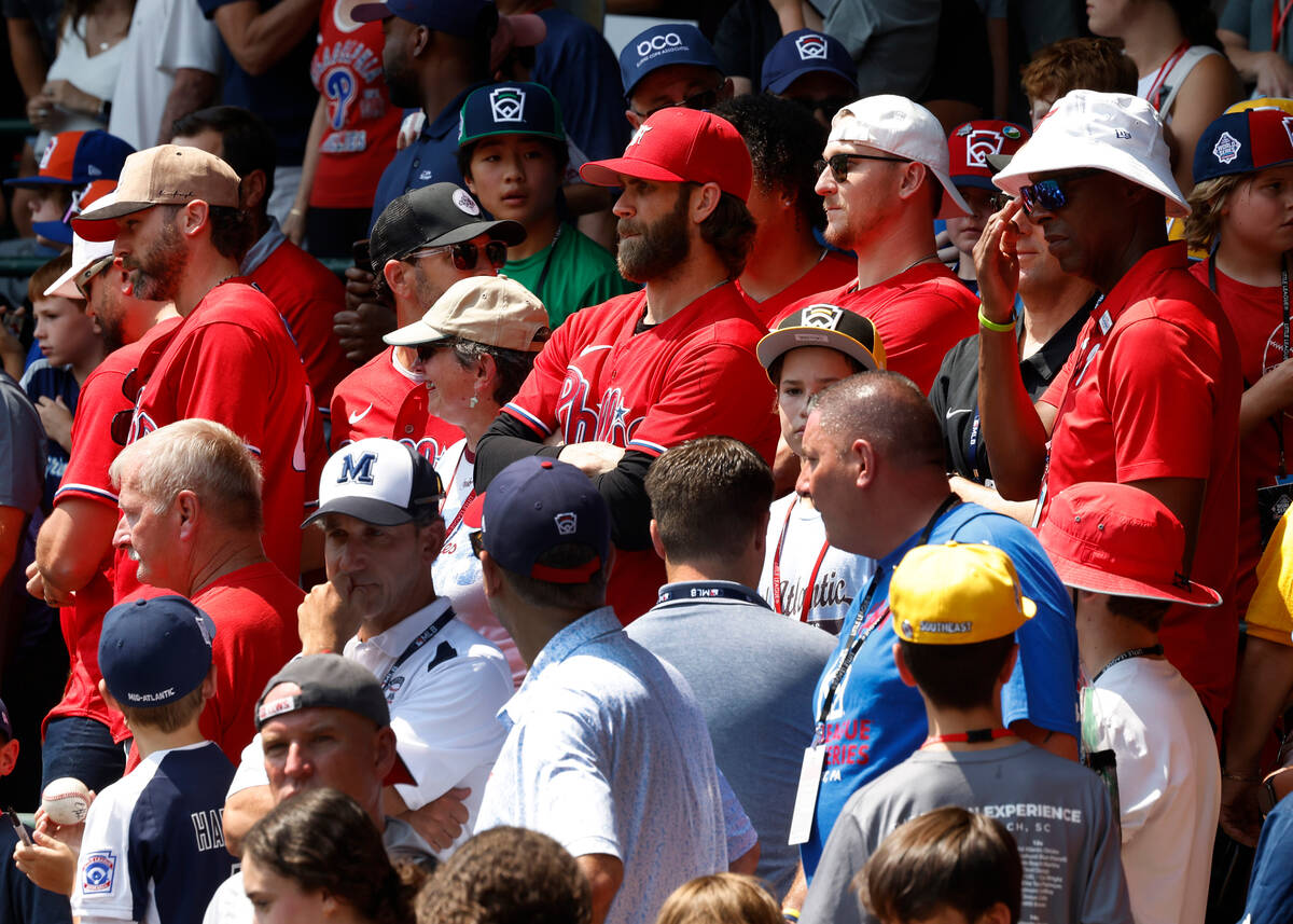 Las Vegas natives Bryce Harper, center, of the Phillies watches a baseball game at Howard J. La ...