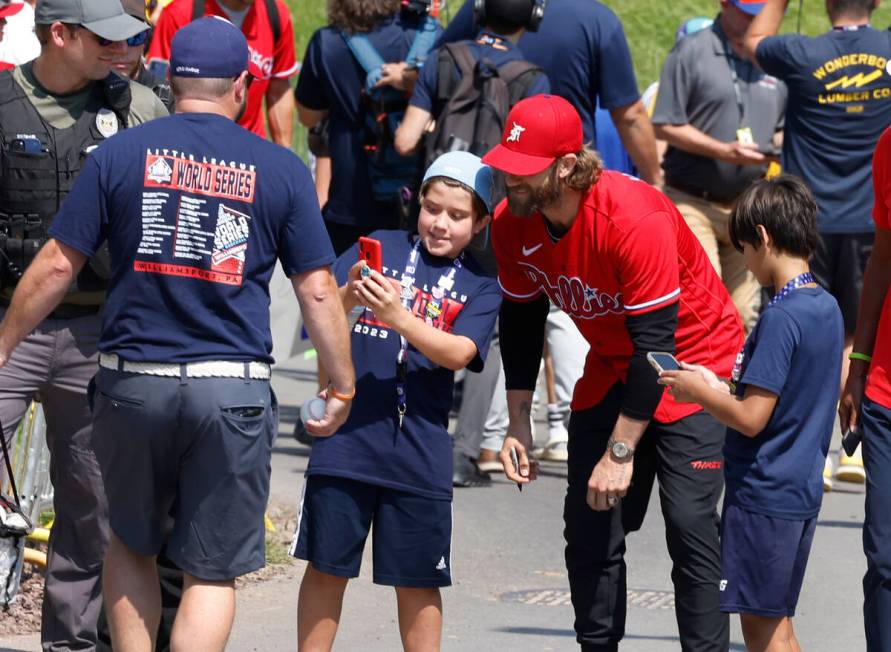 Las Vegas natives Bryce Harper of the Phillies poses for a selfie with a fan outside of Howard ...