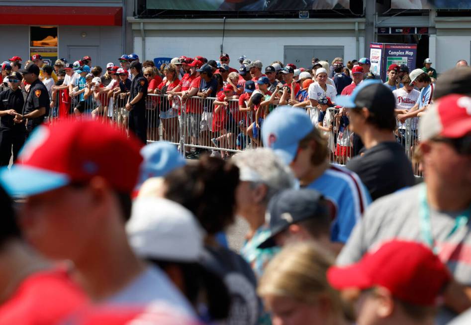 Fans wait for Phillies and Washington Nationals players to arrive at of Howard J. Lamade Stadiu ...