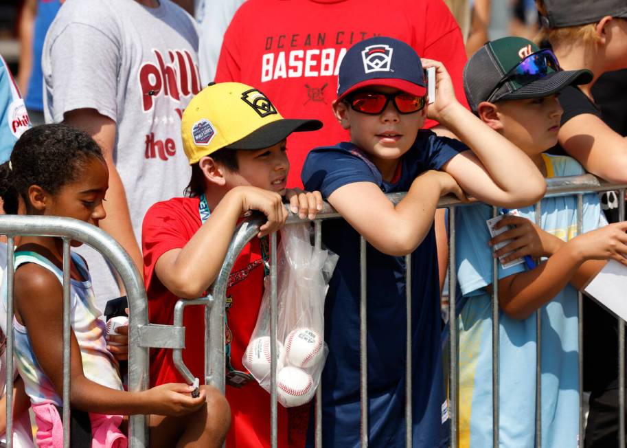 Fans wait for Phillies and Washington Nationals players to arrive at of Howard J. Lamade Stadiu ...