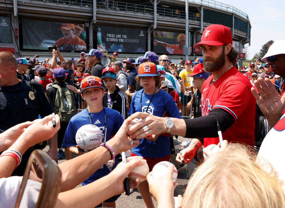 Las Vegas natives Bryce Harper of the Phillies signs autographs for fans outside of Howard J. L ...