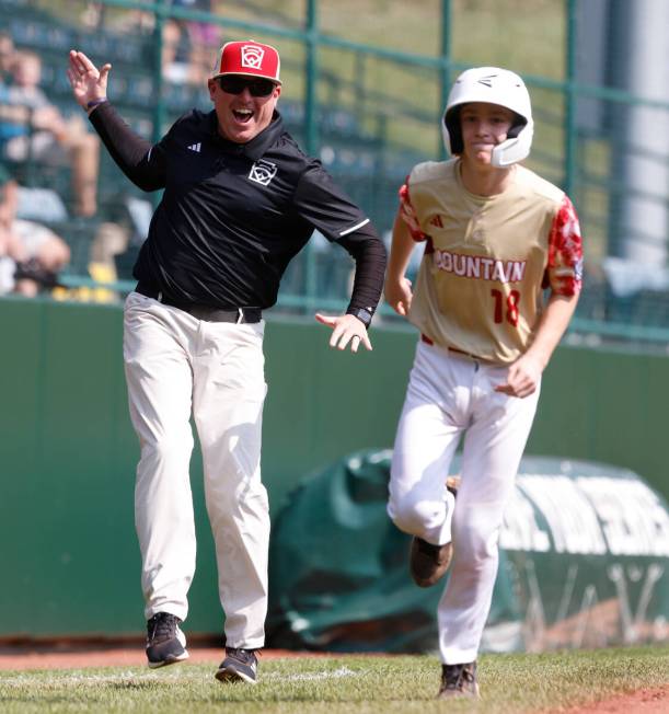 The Henderson assistant coach Arlie Daniel All-Stars reacts as he watches centerfield Nolan Gif ...