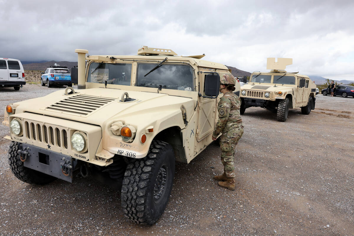 Nevada National Guard military police officers close the road on Nevada State Route 157, also k ...