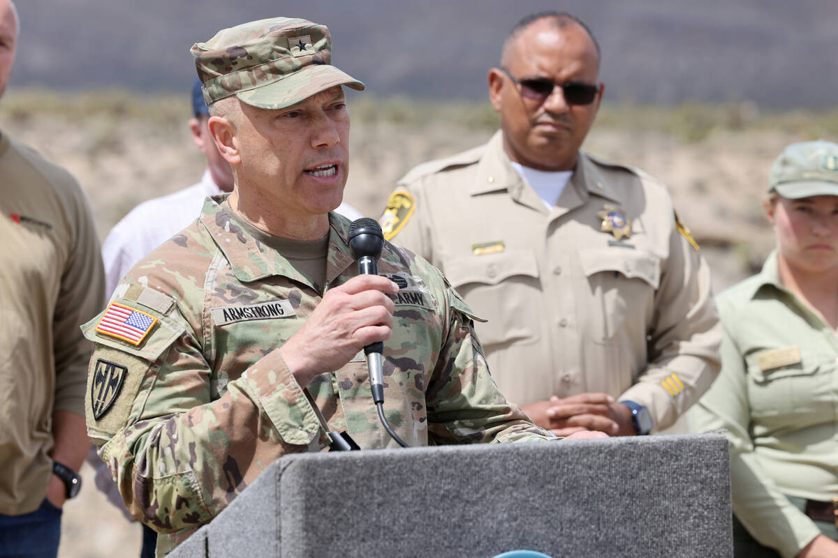 Nevada National Guard Brig. Gen. Troy Armstrong speaks at the closed Nevada State Route 157, al ...