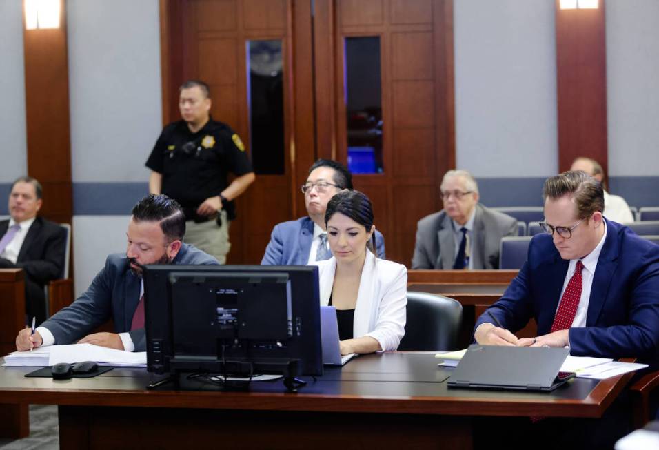 Attorneys Ethan Thomas, from left, Crystal Herrera, center, and Andrew Clark, right, representi ...