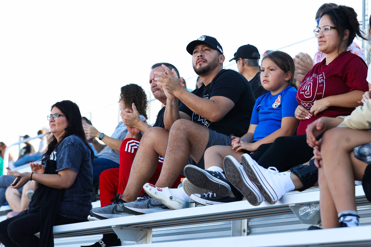 Family and friends cheer on Desert Oasis High School and Foothill High School during a soccer g ...