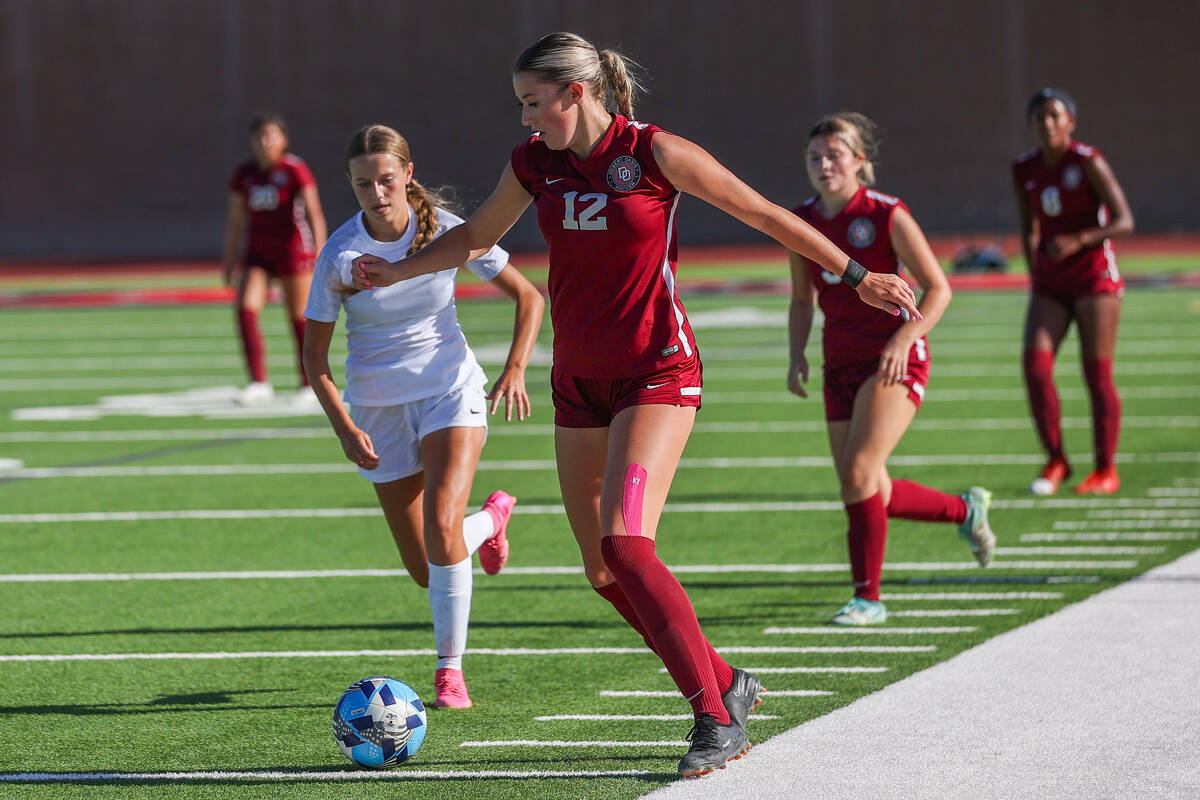Desert Oasis’ Taylor Wehrer (12) dribbles the ball down the field during a soccer game a ...