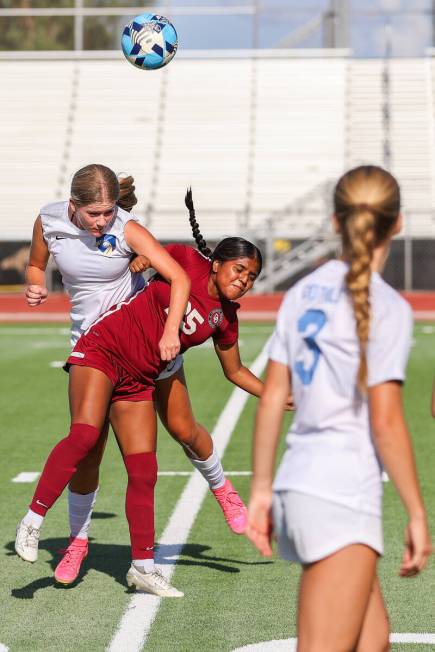 Foothill’s Tianna Hunsaker (9) heads the ball around Desert Oasis’ Amerie Osorio ...