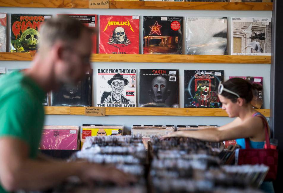 Customers browse the vinyl records at 11th Street Records on Nov. 25, 2017, in downtown Las Veg ...