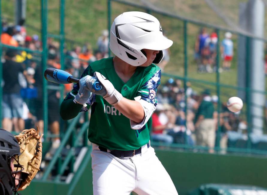 Seattle, Washington's Calvin Shumway is hit by a pitch during the Little League World Series to ...