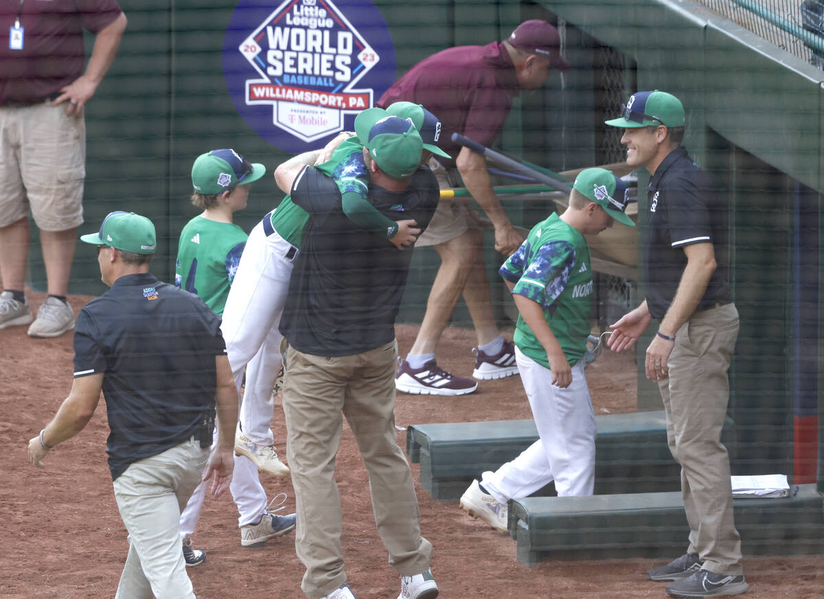 Seattle, Washington, players and coaches celebrate their win against Nolensville, Tennessee, du ...